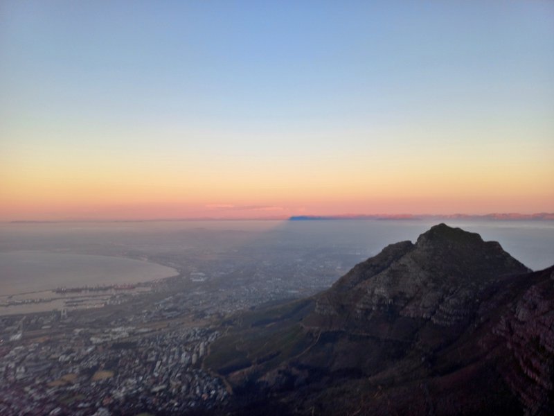 sunset silhouette of Table Mountain from upper cable station, view of City, Devil&#x27;s Peak etc Jan 24