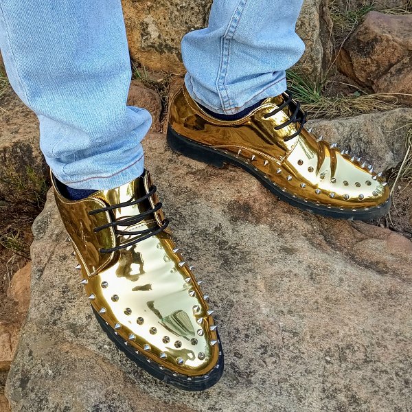 gold shoes on table mountain